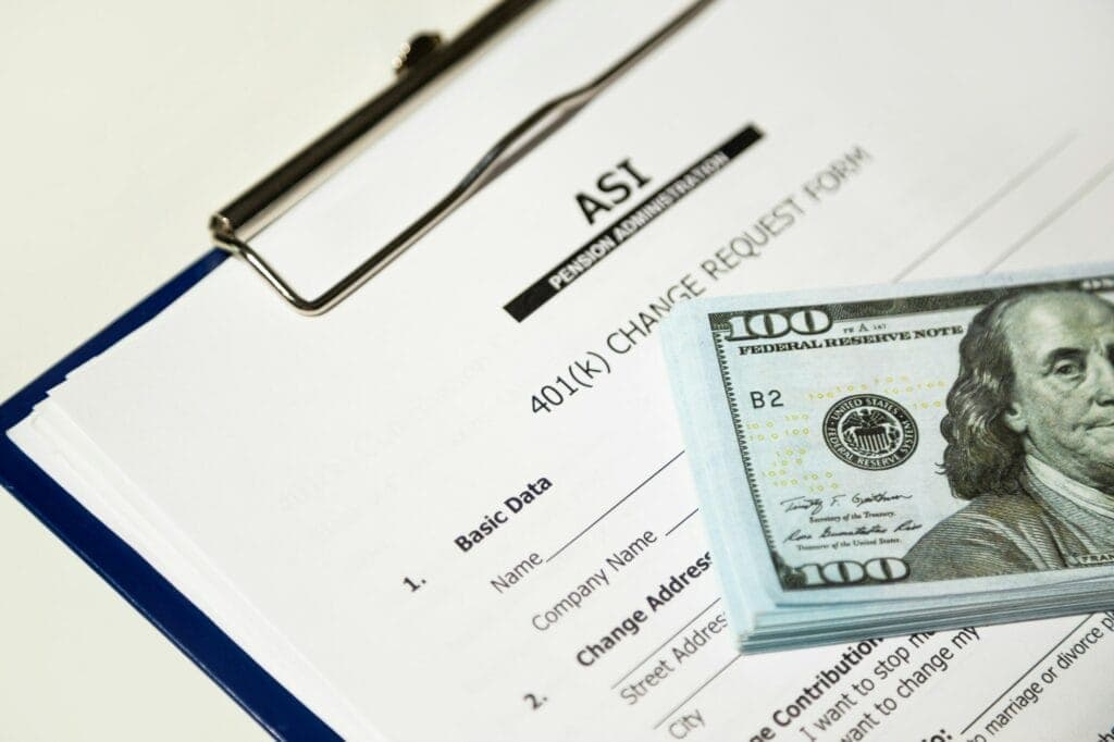 Financial document with a $100 bill on top, related to enterprise technology solutions.