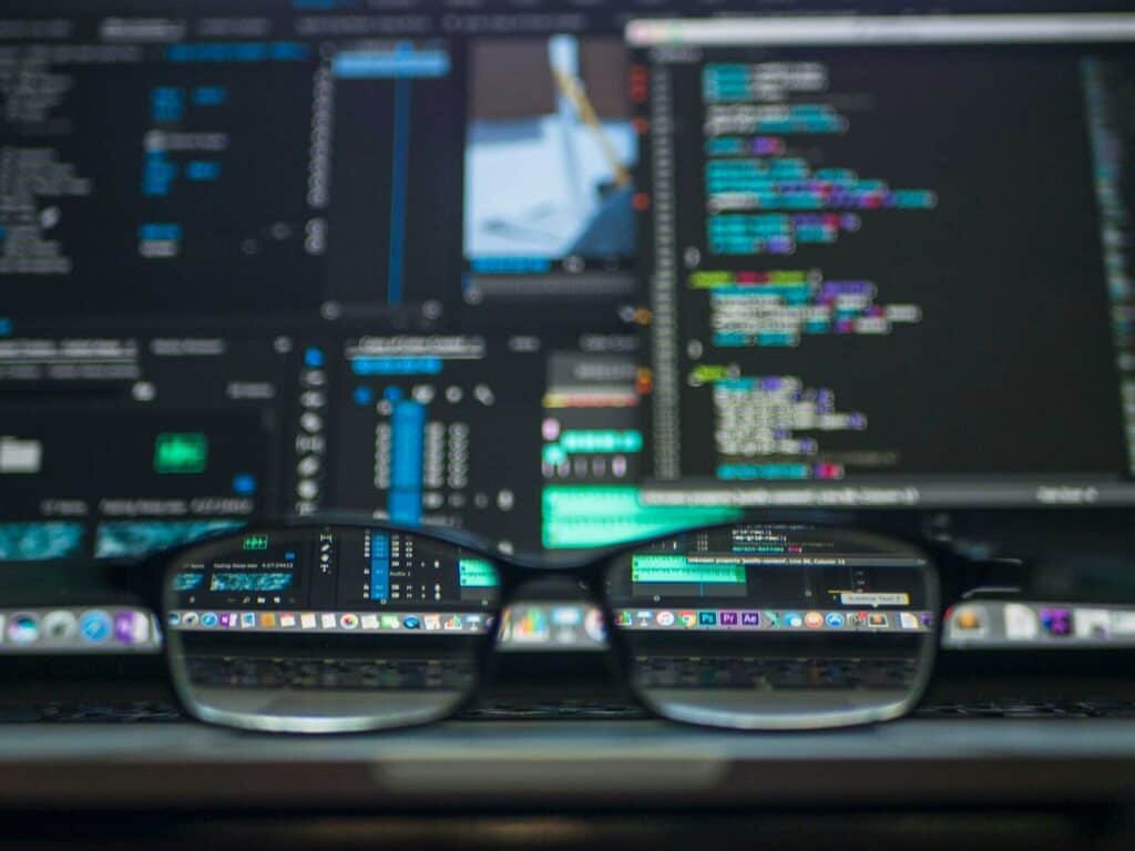 Computer screen displaying cybersecurity code and data analysis.